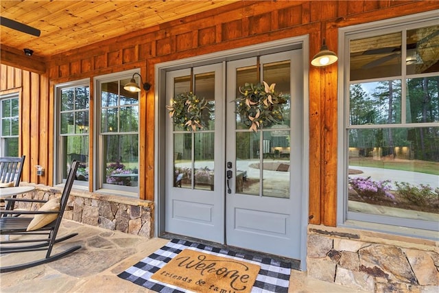 doorway to property featuring french doors and a porch