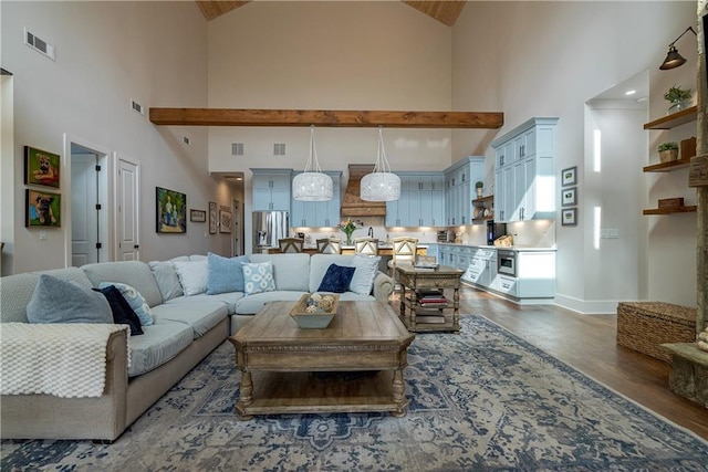 living room with dark wood-type flooring and a high ceiling