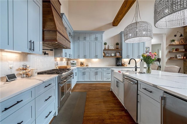 kitchen featuring decorative light fixtures, stainless steel appliances, tasteful backsplash, premium range hood, and beam ceiling