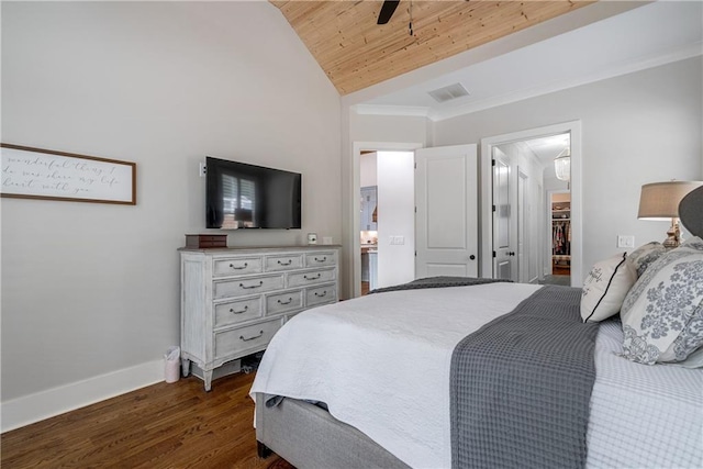 bedroom with a spacious closet, dark wood-type flooring, vaulted ceiling, ceiling fan, and wooden ceiling