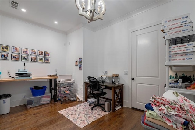 office space with ornamental molding, dark wood-type flooring, and an inviting chandelier