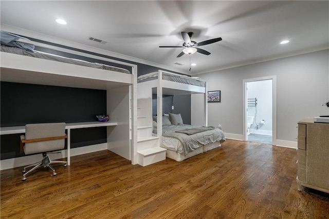 bedroom with hardwood / wood-style floors, ceiling fan, and ornamental molding