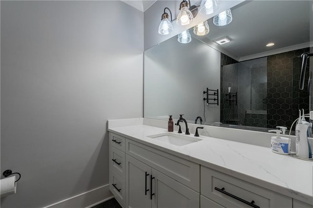 bathroom featuring an enclosed shower and vanity