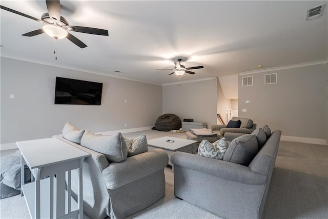 carpeted living room featuring ceiling fan and crown molding