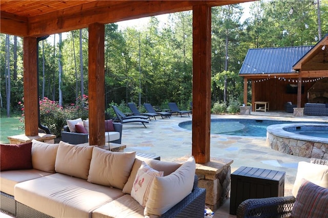 view of pool featuring a patio area, an in ground hot tub, and an outdoor hangout area