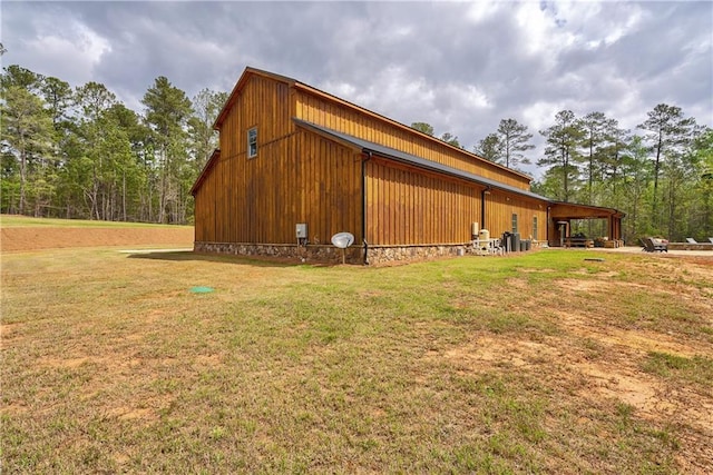 view of side of home featuring a lawn