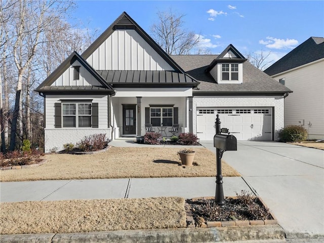 view of front of home featuring a garage and covered porch