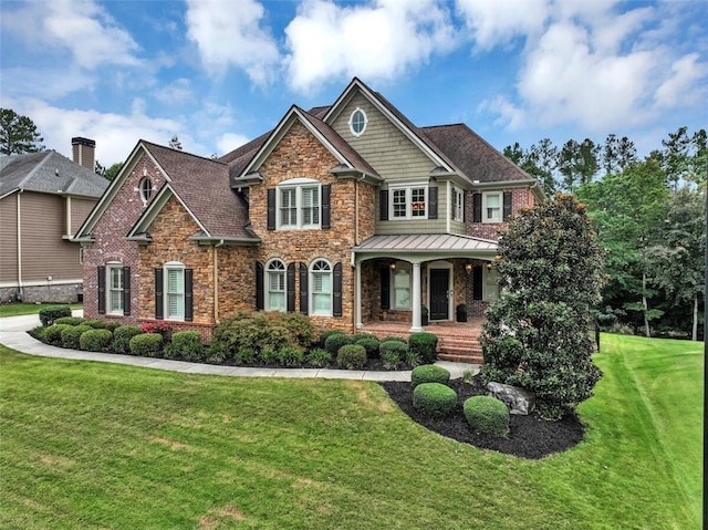 craftsman house featuring a front lawn