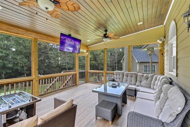 exterior space with ceiling fan and an outdoor living space