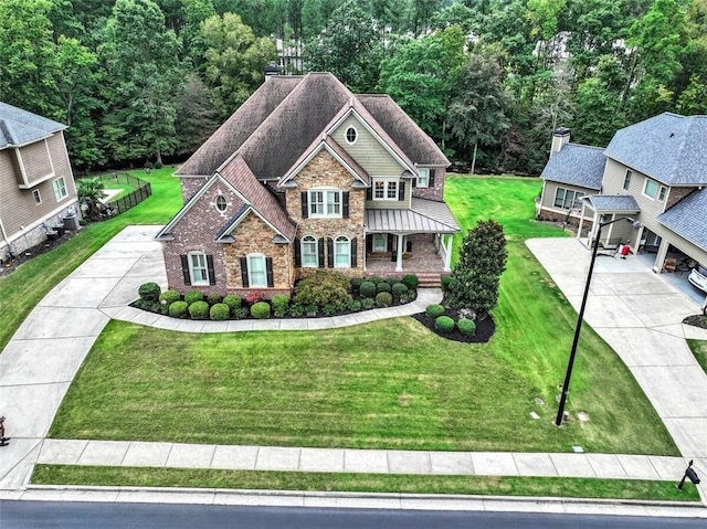 craftsman-style house featuring a front yard