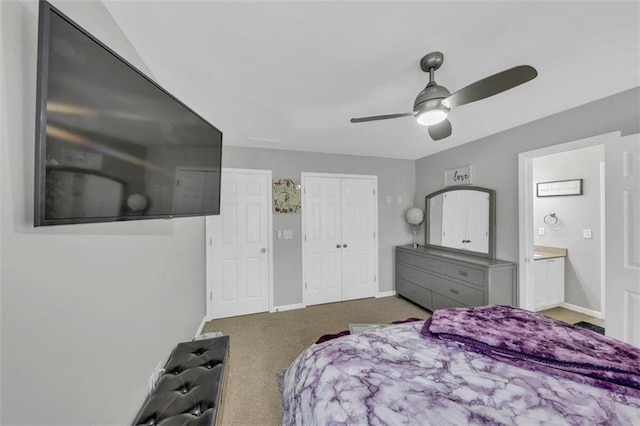 carpeted bedroom featuring ceiling fan and ensuite bathroom