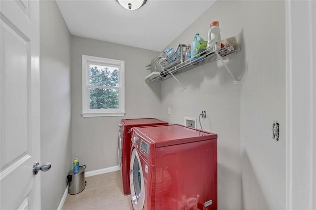 laundry area featuring light tile floors, separate washer and dryer, and washer hookup