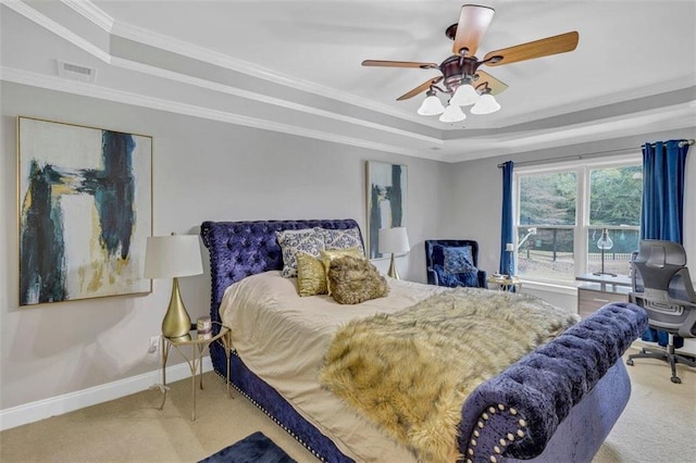 bedroom featuring ceiling fan, crown molding, light carpet, and a raised ceiling