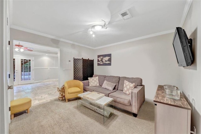 carpeted living room featuring crown molding and ceiling fan