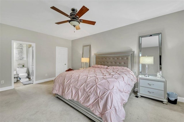 carpeted bedroom with ceiling fan and ensuite bathroom