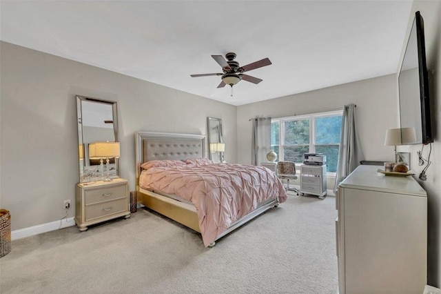 bedroom featuring light carpet and ceiling fan