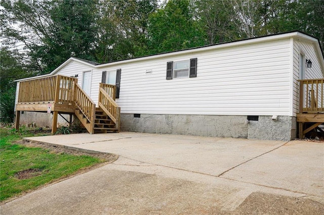 exterior space featuring a wooden deck