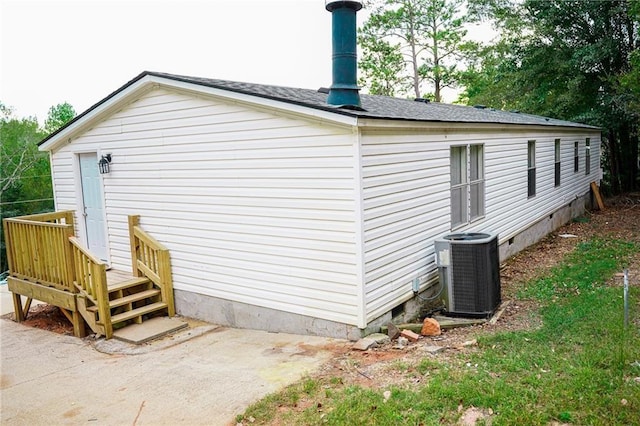 view of home's exterior with central AC unit