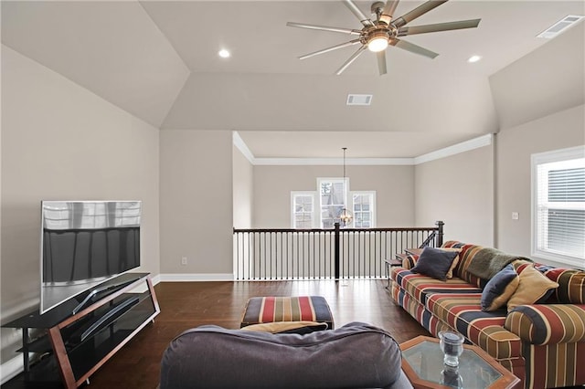 living room featuring dark wood-type flooring, ceiling fan, lofted ceiling, and crown molding