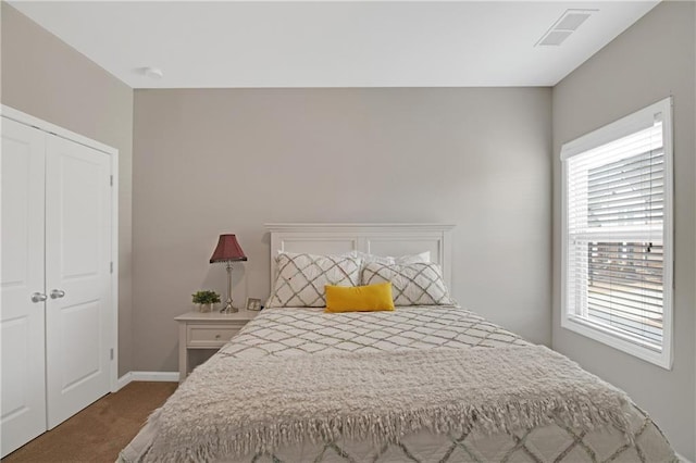 bedroom with carpet floors and a closet