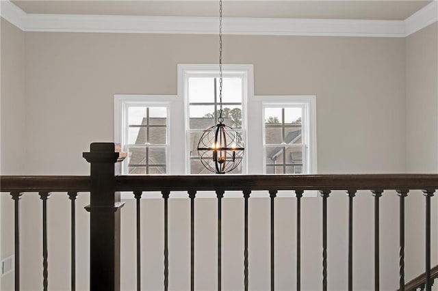 details with ornamental molding, radiator, and an inviting chandelier