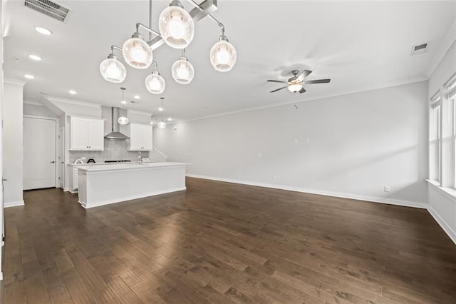 240 Walker Ave, Roswell, GA 30076 - unfurnished living room with dark wood finished floors, baseboards, ornamental molding, and recessed lighting