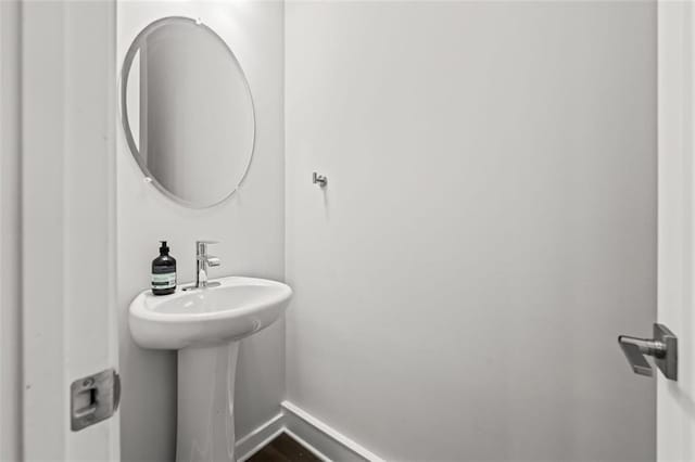240 Walker Ave, Roswell, GA 30076 - bathroom with baseboards and wood finished floors