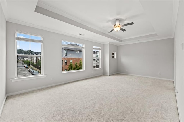 240 Walker Ave, Roswell, GA 30076 - empty room with a raised ceiling, carpet, plenty of natural light, a ceiling fan, and crown molding