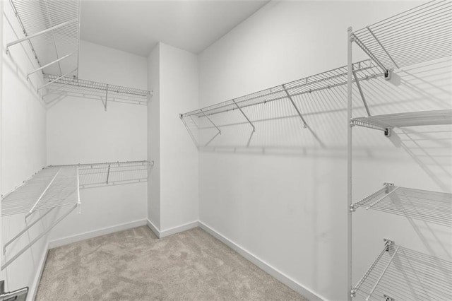 240 Walker Ave, Roswell, GA 30076 - walk in closet with carpet flooring