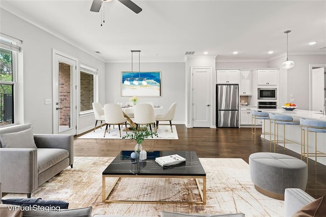 240 Walker Ave, Roswell, GA 30076 - living area featuring crown molding, dark wood-type flooring, ceiling fan, recessed lighting, and baseboards