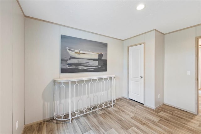 interior space featuring light hardwood / wood-style flooring and ornamental molding