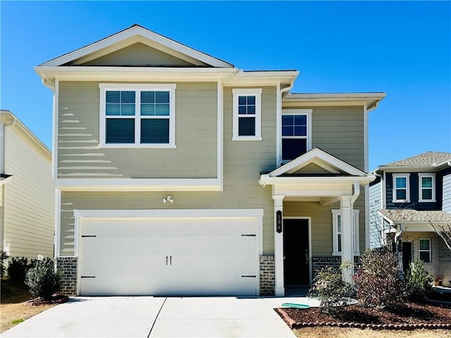 view of front of home with a garage and concrete driveway