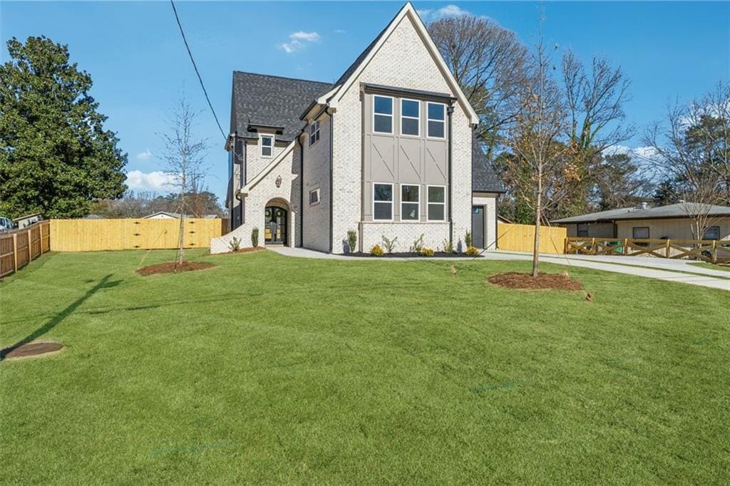 rear view of house with a lawn