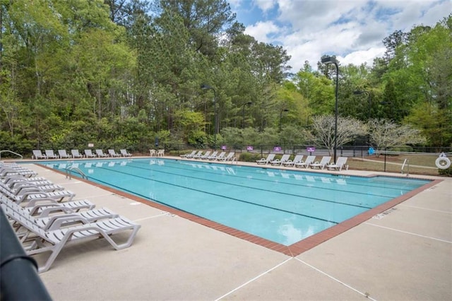 1181 Binghampton Cir, Bogart, GA 30622 - community pool with a patio area and view of wooded area
