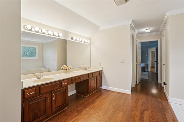 2819 Saddlebrook Way NW, Marietta, GA 30064 - bathroom with double vanity, wood finished floors, ornamental molding, baseboards, and a bathtub