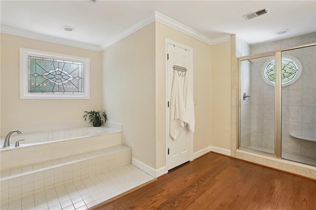 2819 Saddlebrook Way NW, Marietta, GA 30064 - bathroom with wood finished floors, a shower stall, a garden tub, crown molding, and baseboards