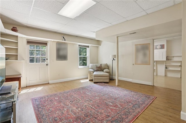 2819 Saddlebrook Way NW, Marietta, GA 30064 - living area featuring baseboards, wood finished floors, plenty of natural light, and a paneled ceiling