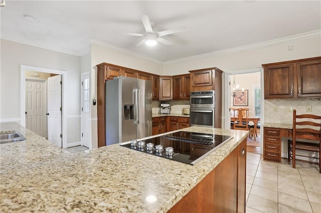 2819 Saddlebrook Way NW, Marietta, GA 30064 - kitchen featuring appliances with stainless steel finishes, decorative backsplash, ceiling fan, ornamental molding, and light stone countertops