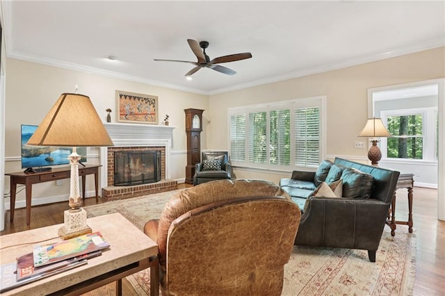 2819 Saddlebrook Way NW, Marietta, GA 30064 - living area featuring healthy amount of natural light, ornamental molding, ceiling fan, wood finished floors, and a brick fireplace