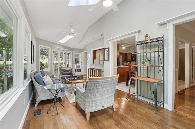 2819 Saddlebrook Way NW, Marietta, GA 30064 - sunroom / solarium featuring a skylight, lofted ceiling, and wood finished floors
