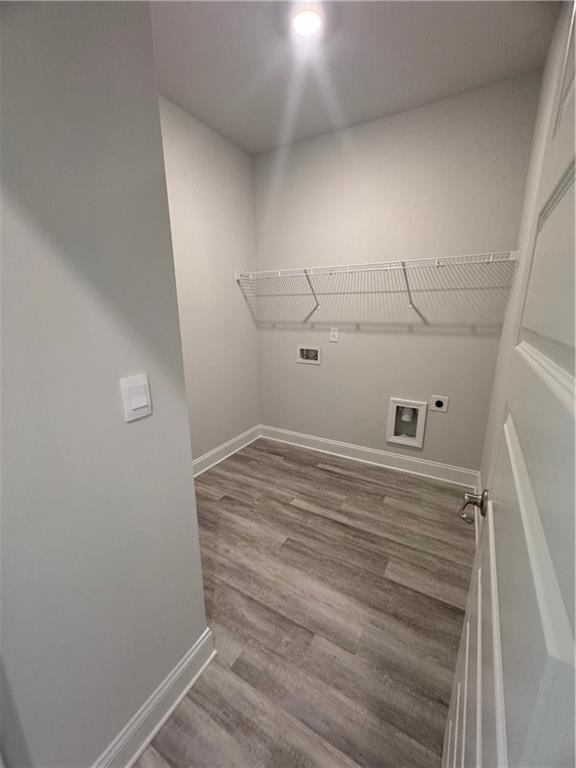 laundry area with washer hookup, electric dryer hookup, and hardwood / wood-style flooring