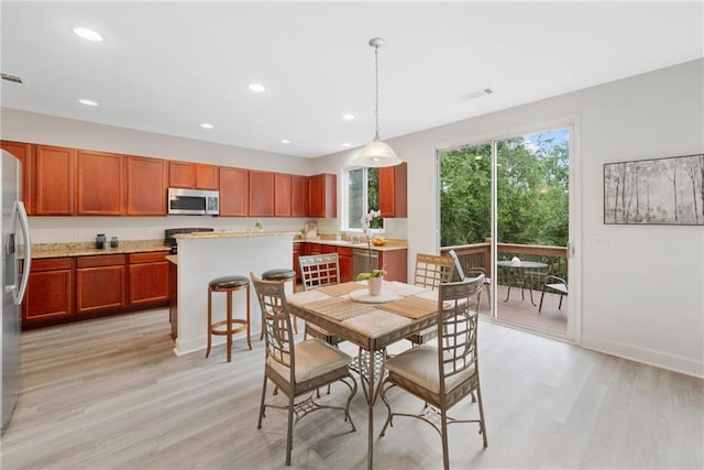 6018 Oakdale Rd SE, Mableton, GA 30126 - dining room featuring light wood-style floors and recessed lighting