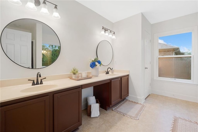 6018 Oakdale Rd SE, Mableton, GA 30126 - full bathroom featuring double vanity and baseboards