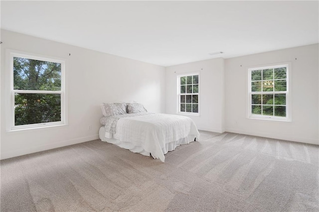 6018 Oakdale Rd SE, Mableton, GA 30126 - carpeted bedroom with multiple windows