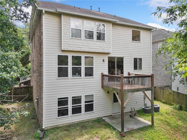 6018 Oakdale Rd SE, Mableton, GA 30126 - rear view of house featuring a patio, a fenced backyard, and a deck
