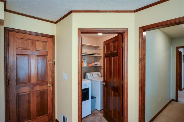 118 Heritage Way, Peachtree City, GA 30269 - laundry area featuring separate washer and dryer, a textured ceiling, baseboards, carpet, and crown molding