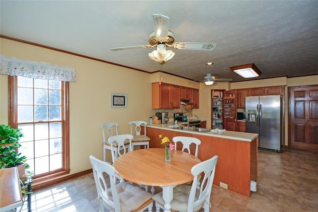 118 Heritage Way, Peachtree City, GA 30269 - dining area featuring a ceiling fan, crown molding, and baseboards