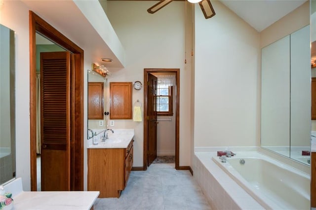 118 Heritage Way, Peachtree City, GA 30269 - bathroom with vanity, a garden tub, a closet, ceiling fan, and vaulted ceiling