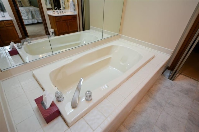 118 Heritage Way, Peachtree City, GA 30269 - ensuite bathroom featuring vanity, a garden tub, and tile patterned floors
