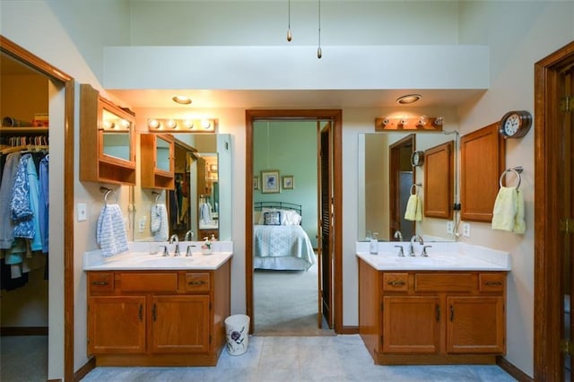 118 Heritage Way, Peachtree City, GA 30269 - ensuite bathroom with two vanities, tile patterned floors, and baseboards